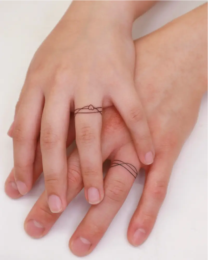 Fine Line Heart Wedding Ring Tattoo