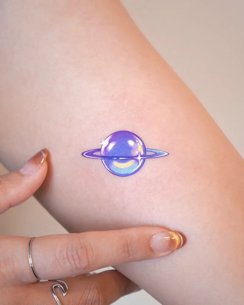 Glossy Minimal Saturn Tattoo