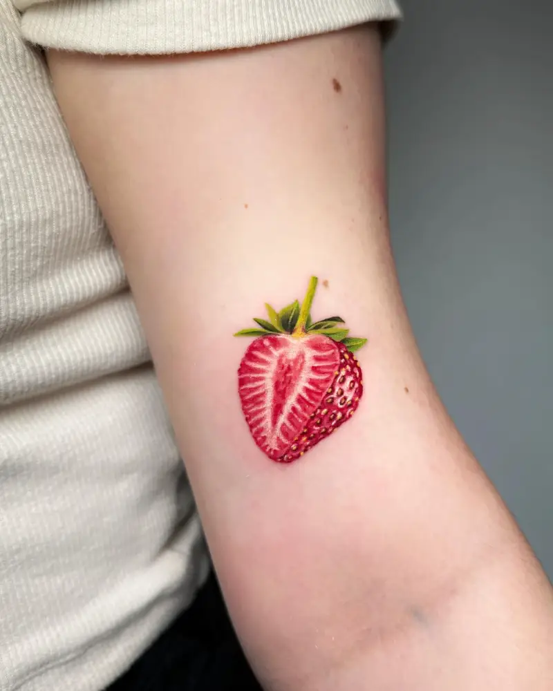 Hyper Realistic Half Cut Strawberry Tattoo