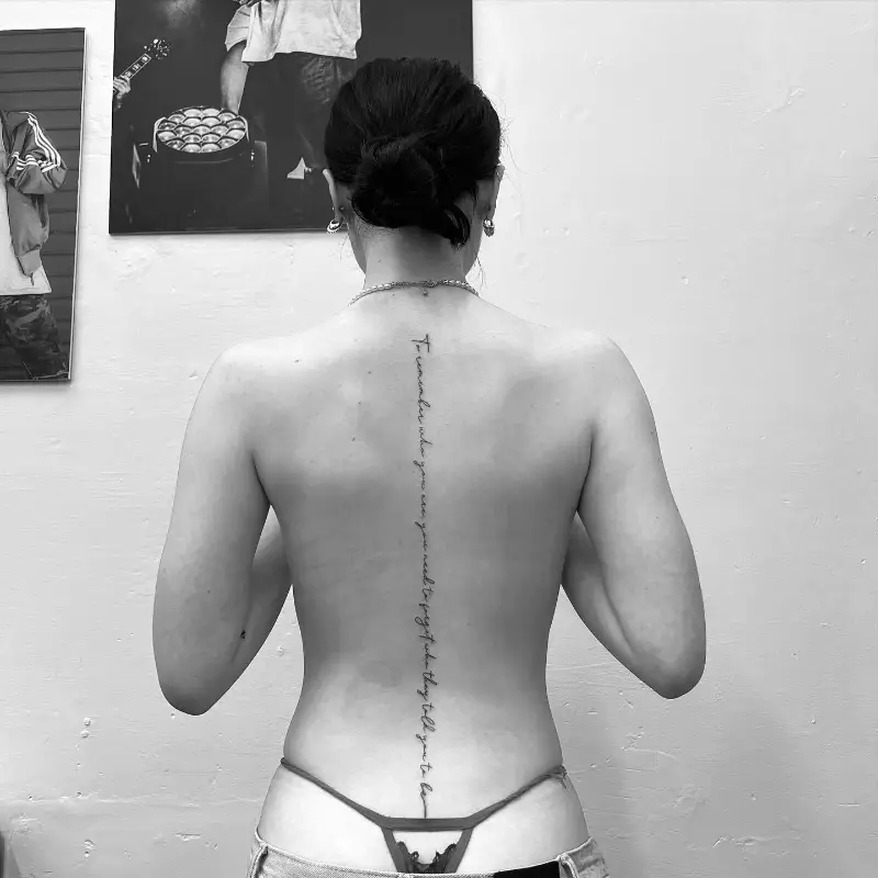 Long Quote Spine Tattoo