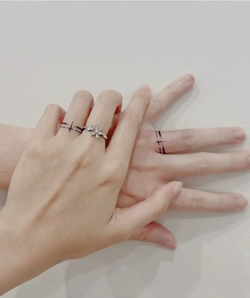 Minimal Cross Wedding Ring Tattoo