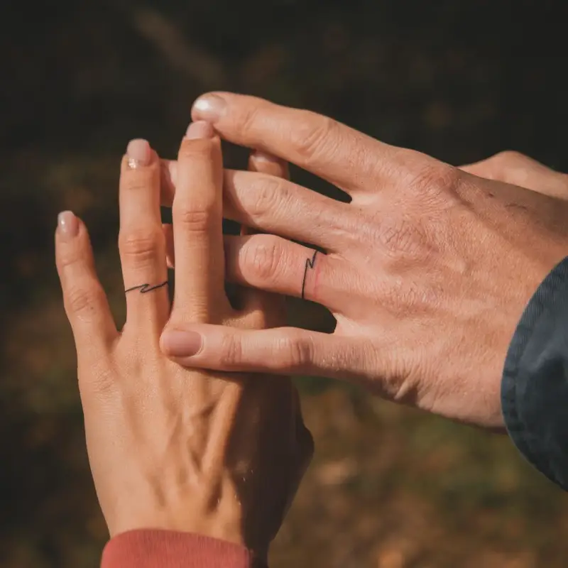 Minimal Wave Wedding Ring Tattoo