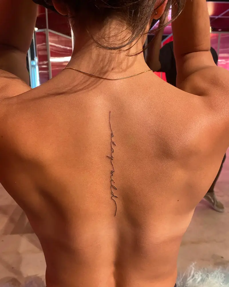 Minimal Word Spine Tattoo