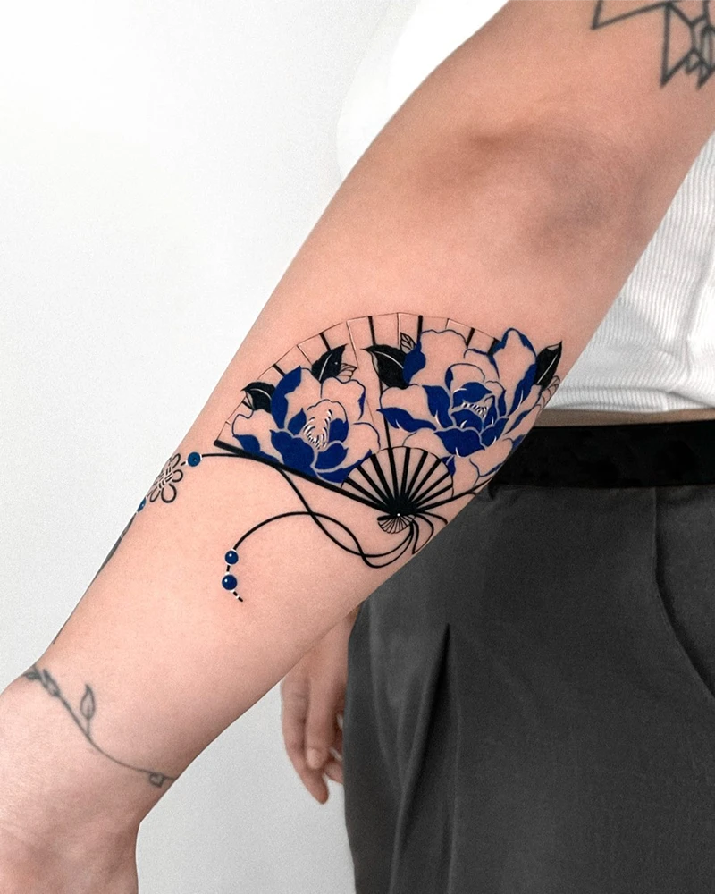 Minimalist Blue Floral Fan Tattoo