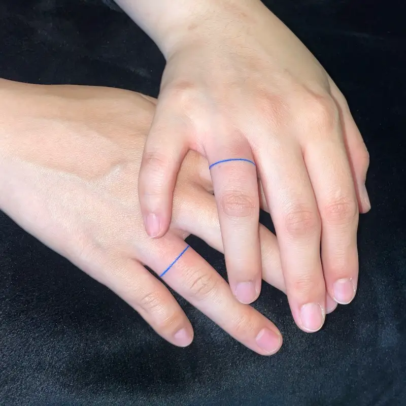 Minimalist Blue Line Wedding Ring Tattoo