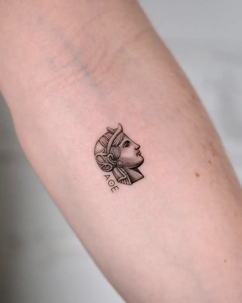 Minimalist Micro Athena Profile Tattoo