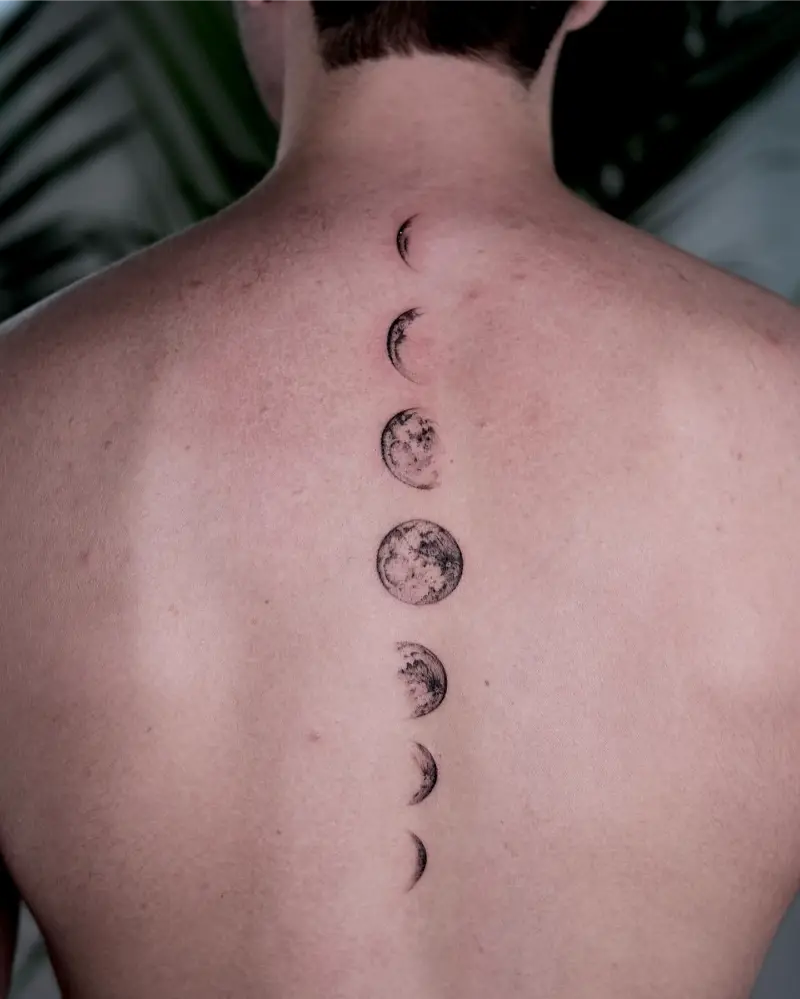 Minimalist Moon Phase Spine Tattoo