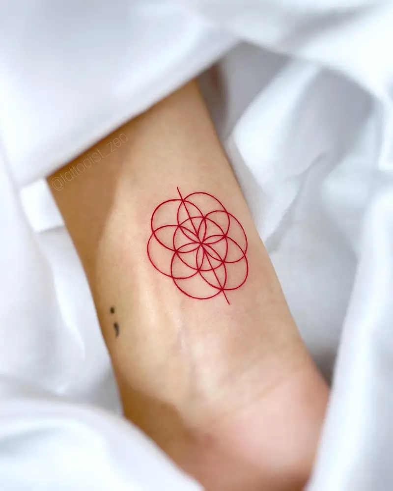 Minimalist Red Ink Flower of Life Tattoo