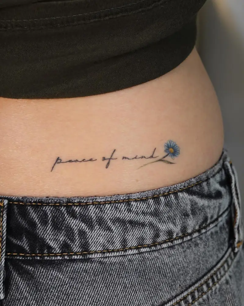 Minimalist Script Flower Belly Tattoo