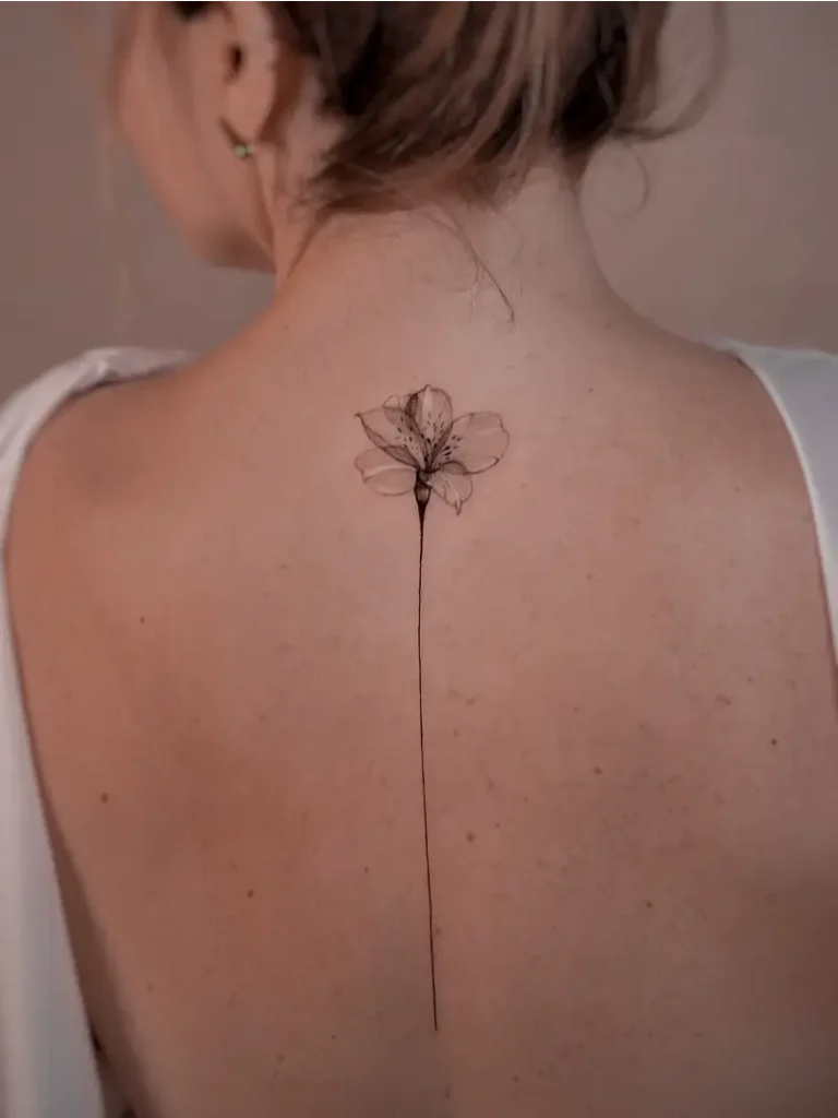 Minimalist Single Flower Spine Tattoo