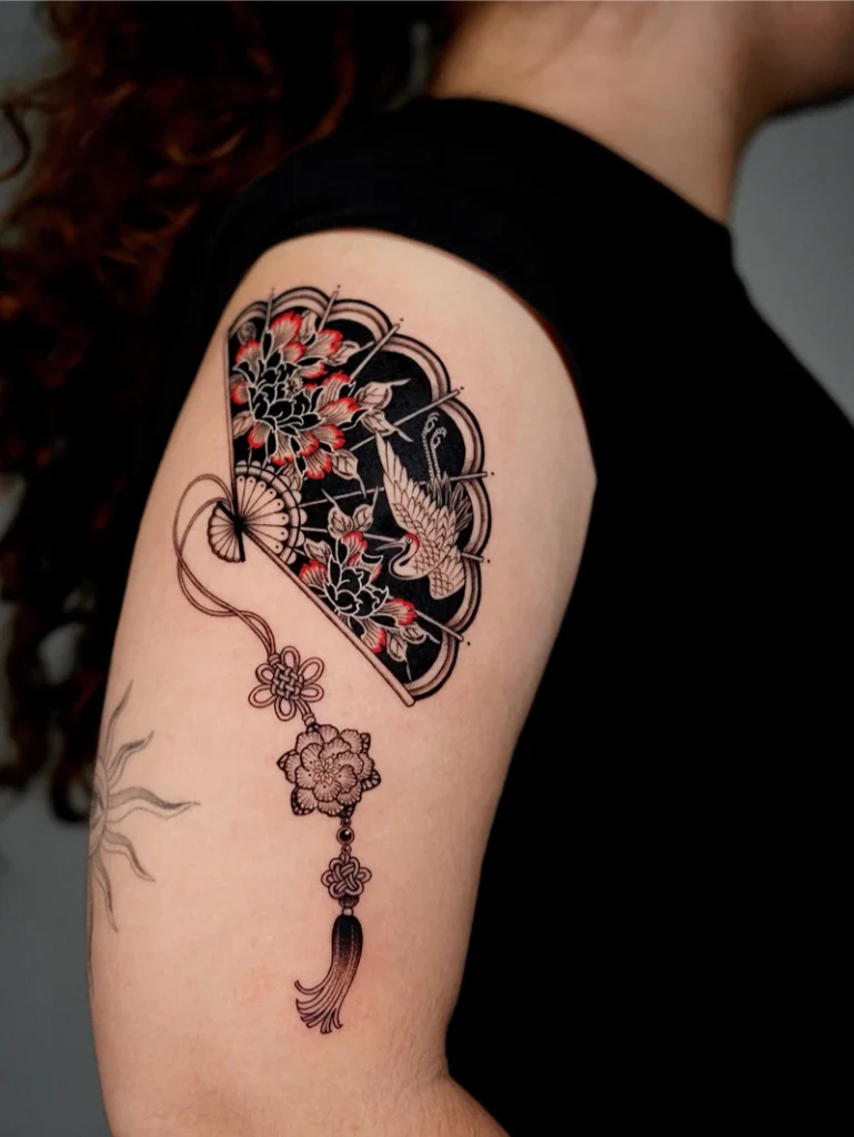 Ornamental Blackwork Crane Fan Tattoo