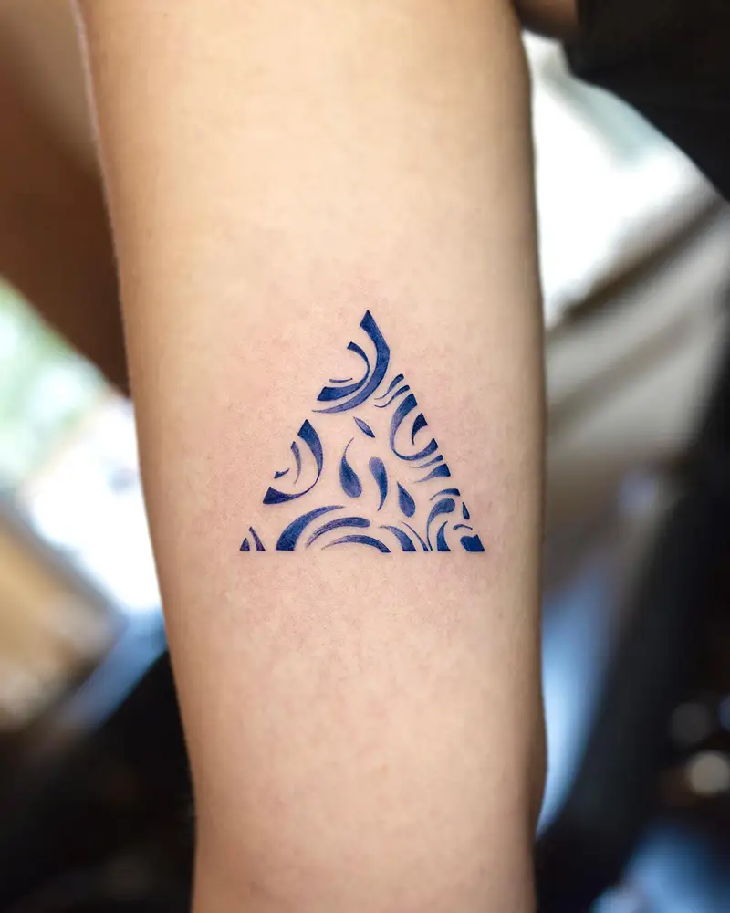 Ornamental Blue Triangle Tattoo