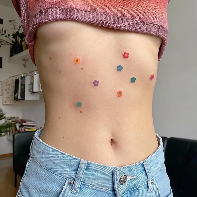 Playful Colorful Flower Belly Tattoo