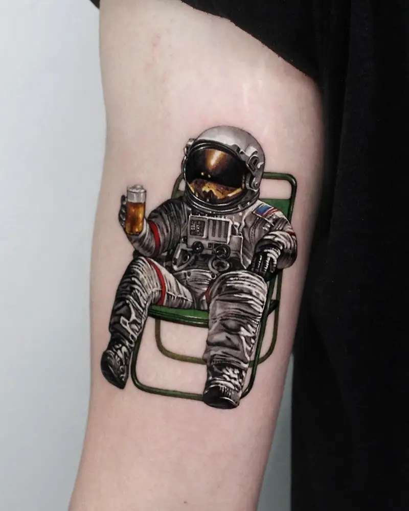 Realistic Astronaut Relaxing With Beer Tattoo