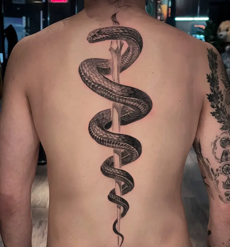 Realistic Coiled Snake Spine Tattoo