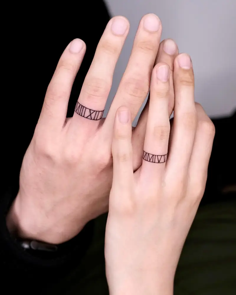 Roman Numerals Wedding Ring Tattoo