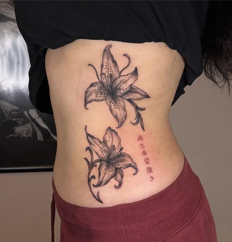 Soft Black and Grey Lily Belly Tattoo