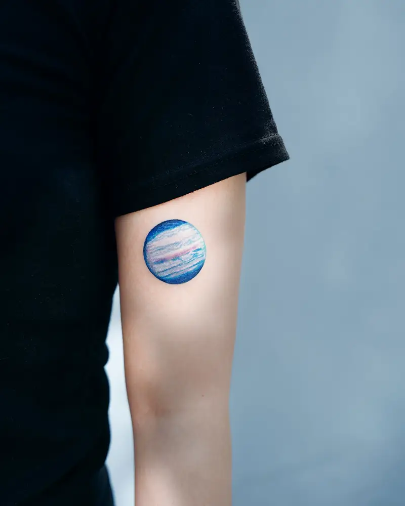 Soft Color Neptune Planet Tattoo