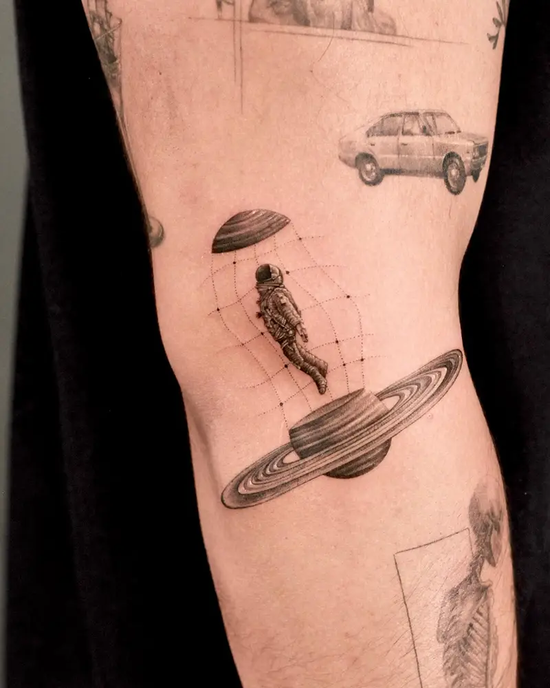 Surreal Astronaut Saturn Planet Tattoo
