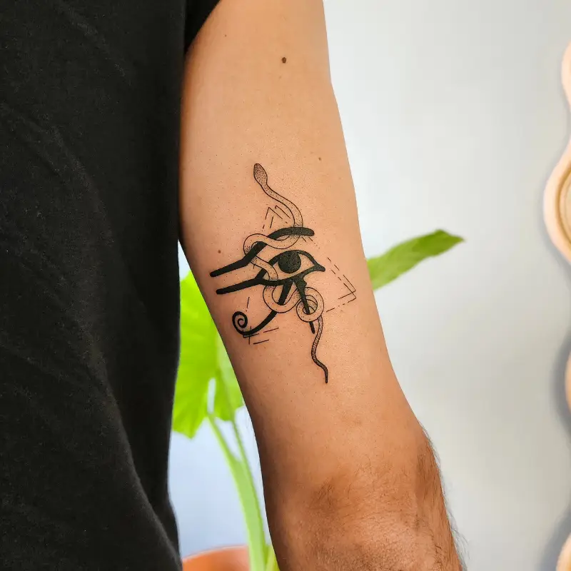 Symbolic Serpent Eye of Horus Tattoo