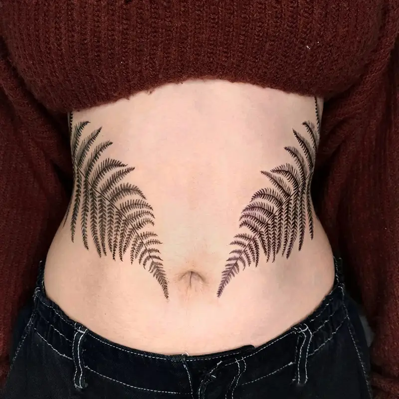 Symmetrical Fern Frond Belly Tattoo