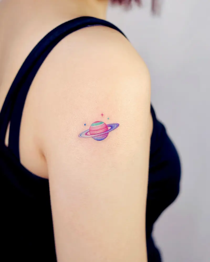 Tiny Colorful Saturn Planet Tattoo