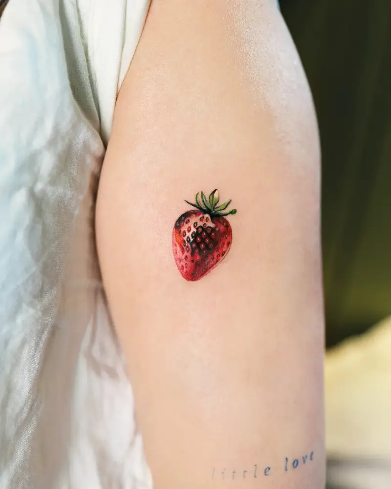 Tiny Realistic Strawberry Tattoo