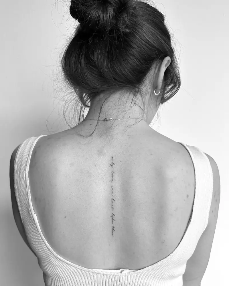 Tiny Script Spine Tattoo