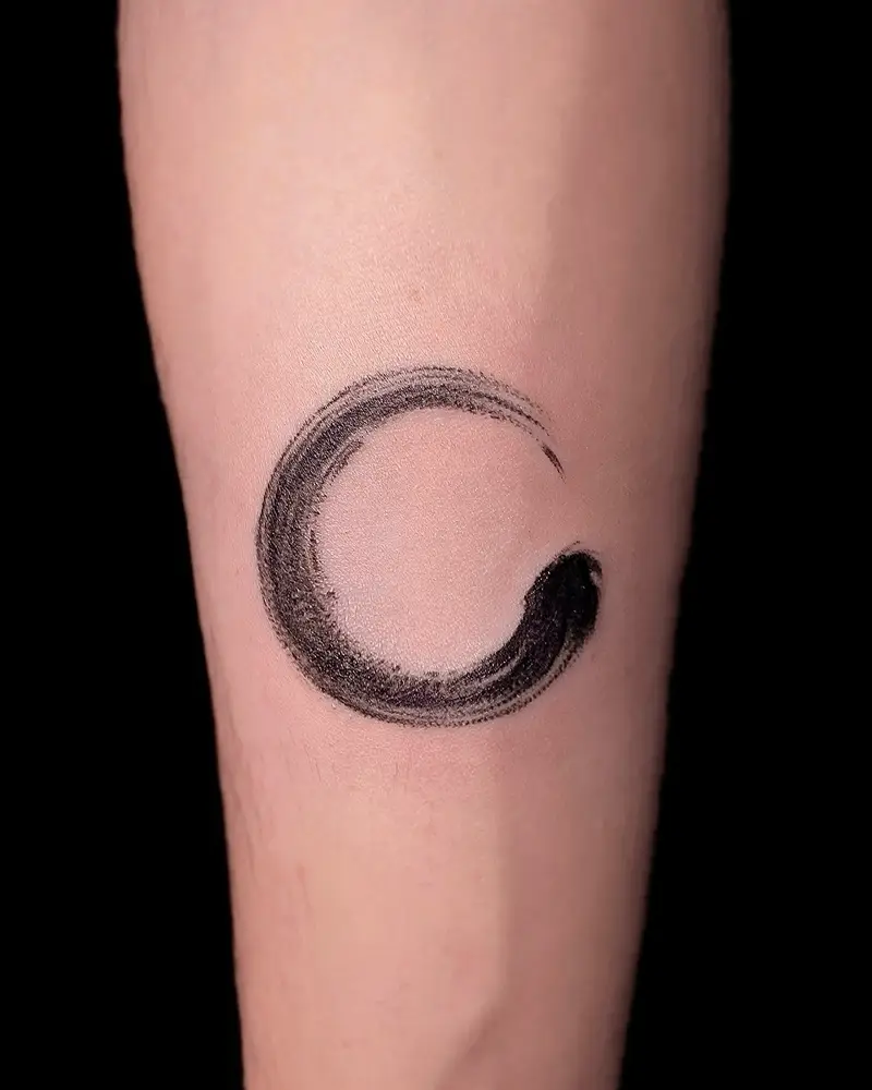 Zen Brushstroke Circle Tattoo